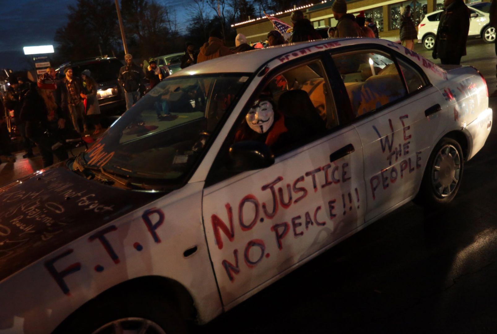 Protesters at Ferguson police station, awaiting grand jury decision